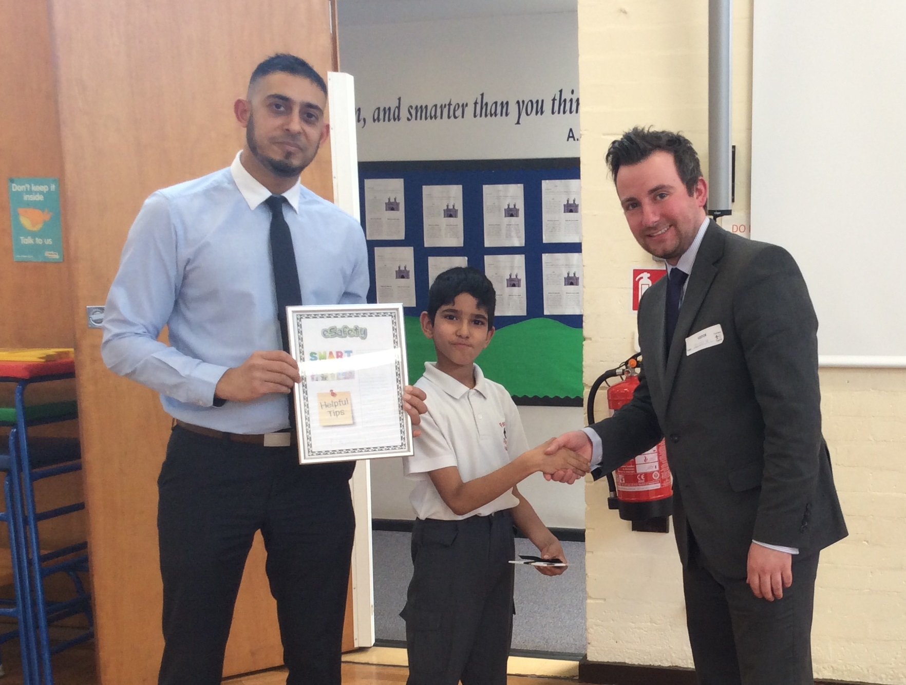 3rd place Jatinder from Hargate Primary School receiving prize form Alex Cox, PK Education and teacher, Mr Anwar